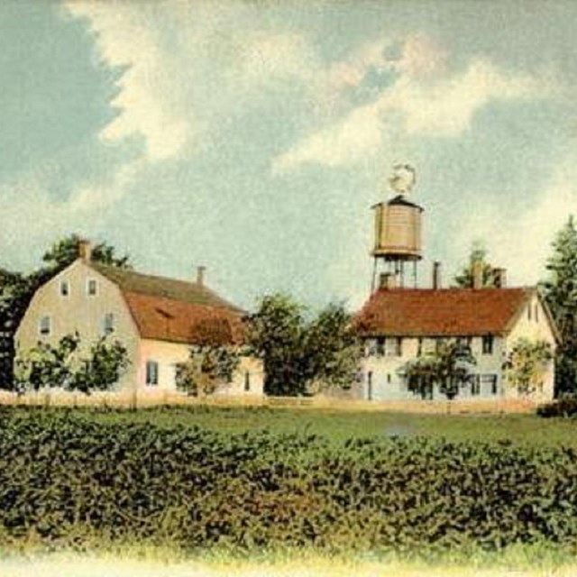 photo of green landscape with old houses. CC0